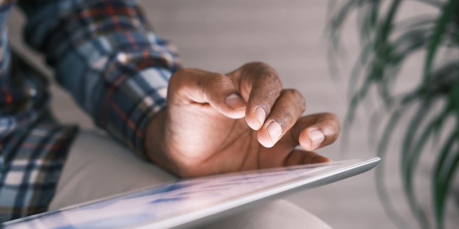 person on tablet looking through information