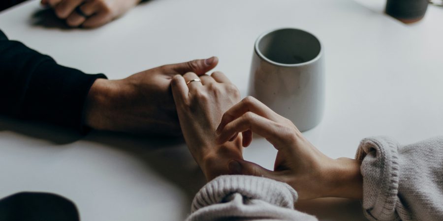 End-of-life wishes - two people holding hands