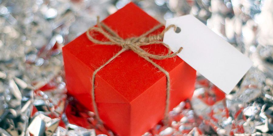 Little red box with a shiny background - How to maximize your gift card value this holiday season